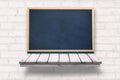 blackboard on a wooden shelf Royalty Free Stock Photo