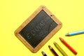 blackboard with the word education written with colorful paints. flat lay