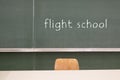 Blackboard word Flight school on a blackboard