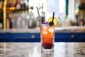 blackcurrant soda in a clear glass with a bendable straw Royalty Free Stock Photo