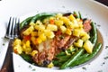 BLACKENED GROUPER with mango salsa, and green beans Royalty Free Stock Photo