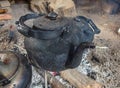 Blackened kettle on an open fire Royalty Free Stock Photo
