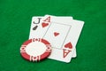 Blackjack hand with casino chip on green table Royalty Free Stock Photo