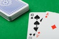 Blackjack.Playing cards on a green background