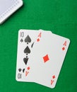 Blackjack.Playing cards on a green background Royalty Free Stock Photo