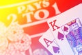 Blackjack playing cards hand on colorful background with chips s Royalty Free Stock Photo