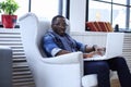 A blackman sitting on the chair