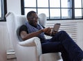 A blackman sitting on the chair Royalty Free Stock Photo