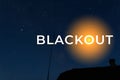 Blackout, power grid overloaded. Blackout concept. Earth hour. Burning flame candle and power lines on background Royalty Free Stock Photo