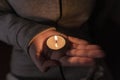 Blackout. Power outage concept. Girl holding a burning candle in her hands Royalty Free Stock Photo