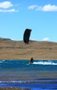 Blackred kitesurfer cruising