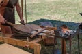 Blacksmith Blows Coals with Bellows, Working Tool Royalty Free Stock Photo