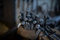 Blacksmith decorative elements horseshoes nails at forge, workshop. Royalty Free Stock Photo
