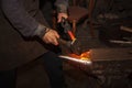 Blacksmith forfing hot iron