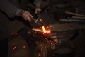 Blacksmith forfing hot iron Royalty Free Stock Photo