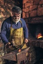 Blacksmith forge iron at work