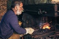 Blacksmith forge iron at work