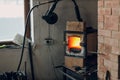 Blacksmith forge oven with hot flame. Smith heating iron piece of steel in fire of red-hot forge Royalty Free Stock Photo