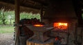 Blacksmith Forging Metal with Hot Fire on Anvil Royalty Free Stock Photo