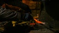 Blacksmith forging molten metal Royalty Free Stock Photo