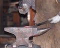 Blacksmith With Hammer And Anvil