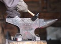 Blacksmith With Hammer And Anvil