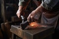 blacksmith hammering hot iron on anvil Royalty Free Stock Photo