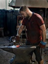 Blacksmith hand hammer forges red-hot iron product