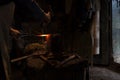 Blacksmith in his workshop forging Royalty Free Stock Photo