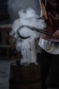 blacksmith holding iron work in forge Royalty Free Stock Photo