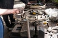 Blacksmith making wrought Iron with industrial bender equipment machine for metal bending. Royalty Free Stock Photo