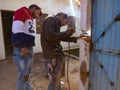 blacksmith man welding on door during house renovation in India January 2020