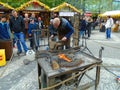 Blacksmith and an old blacksmith work at the Easter markets. Prague, Czech Republic,