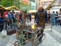 Blacksmith and an old blacksmith work at the Easter markets. Prague, Czech Republic,