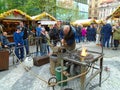 Blacksmith and an old blacksmith work at the Easter markets. Prague, Czech Republic,