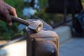 blacksmith performs the forging of hot glowing metal on the anvil