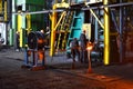 Blacksmith processes the red hot iron under a huge press. Metal forging, stamping under hammer forge at workshop of forge foctory Royalty Free Stock Photo