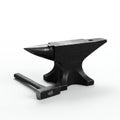 Blacksmith tools displayed on a white surface. An anvil, featuring a flat top and horn, is paired with a hammer Royalty Free Stock Photo