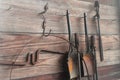 Blacksmith tools hanging on wooden wall Royalty Free Stock Photo
