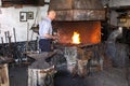 Blacksmith At Work In his Forge