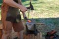 Blacksmith Working Incandescent Iron with Hammer and Anvil