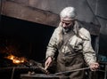 Blacksmith working in the smithy Royalty Free Stock Photo