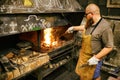 Blacksmith working in workshop Royalty Free Stock Photo