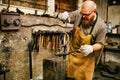 Blacksmith working in workshop Royalty Free Stock Photo