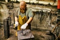 Blacksmith working in workshop Royalty Free Stock Photo