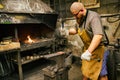 Blacksmith working in workshop Royalty Free Stock Photo