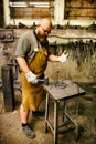 Blacksmith working in workshop Royalty Free Stock Photo