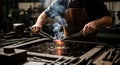 Blacksmith forging metal with fire and tools in workshop Royalty Free Stock Photo