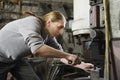 Blacksmith Working In Workshop Royalty Free Stock Photo