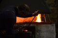 The blacksmith works at night Royalty Free Stock Photo